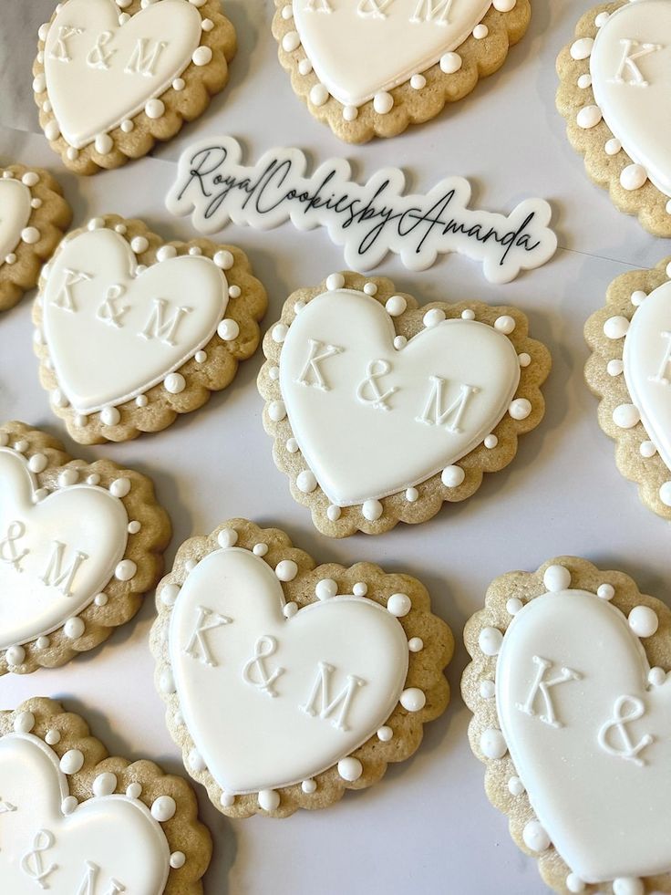 Elegant Heart-Shaped Cookies with Intricate Icing and Personalized Initials