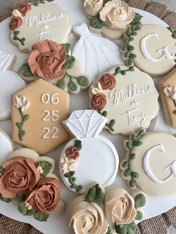 Elegant Floral-Themed Decorative Cookie Assortment in Soft Pastels.