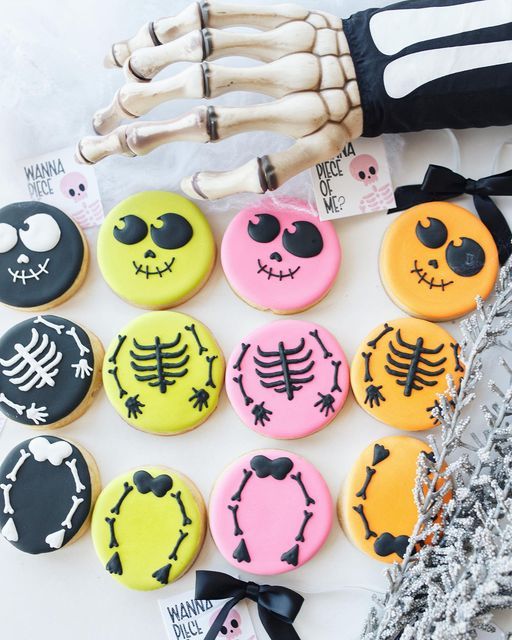 Festive Halloween Cookies with Whimsical Skeleton Designs in Vibrant Colors