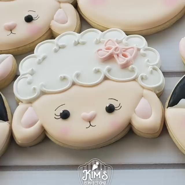 Adorable Pastel Sheep Cookie Design with Fluffy Icing and Charming Bow.