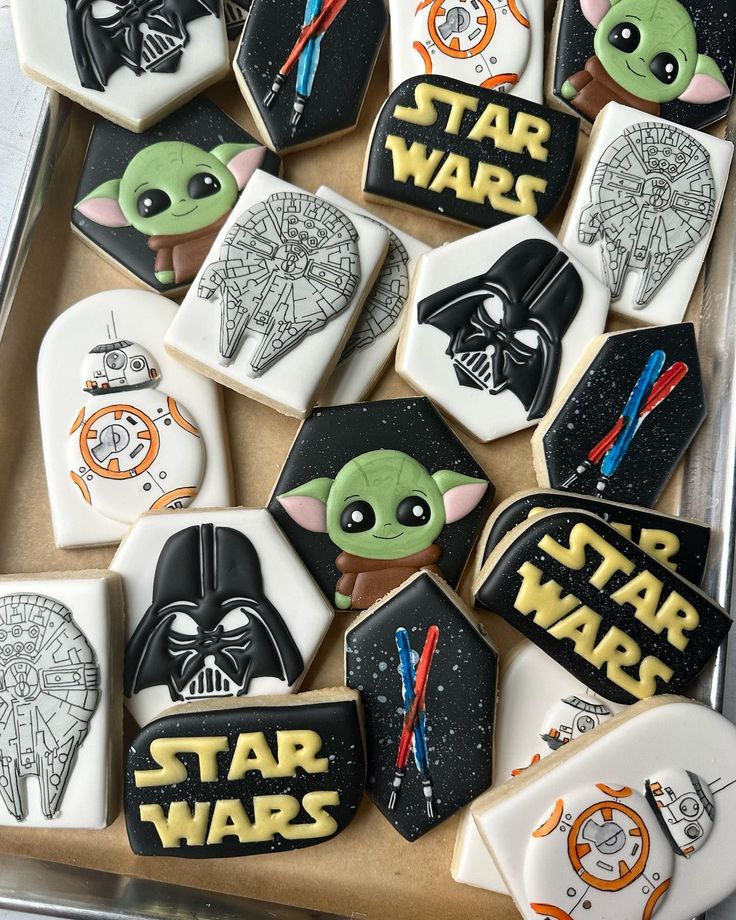 Whimsical Space Saga-Inspired Cookie Designs Featuring Iconic Characters and Craftsmanship for Themed Celebrations.