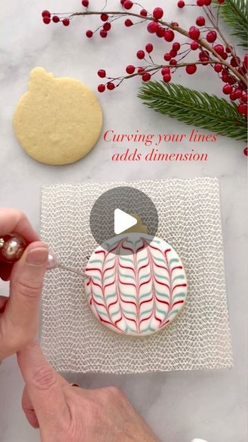 Festive Cookie Decoration: Swirling Red and Green Designs on a White Base