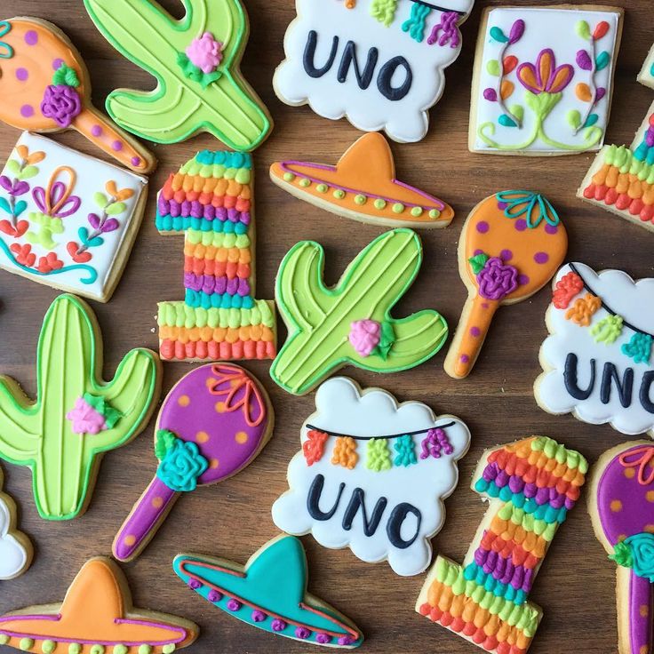 Festive and Vibrant Cookie Designs with Cacti, Sombreros, and Floral Patterns.