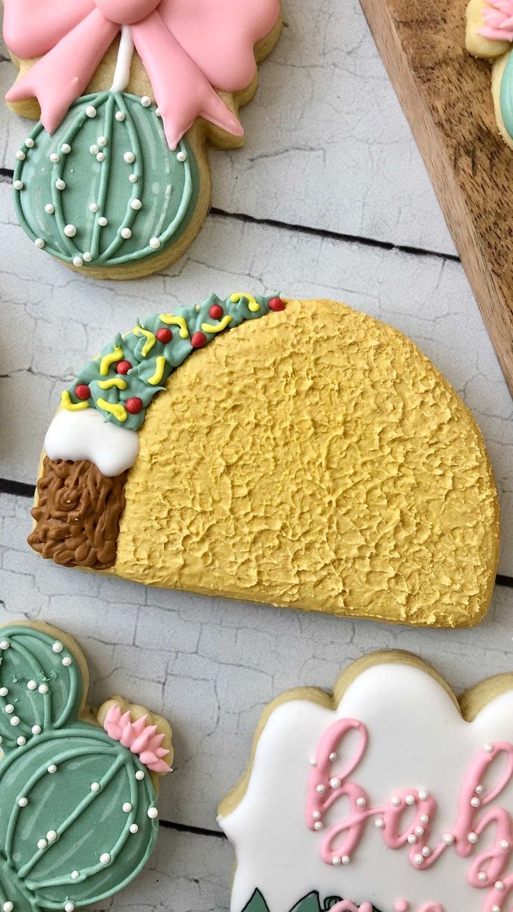 Festive Colorful Cookie Designs: Taco, Cactus, and Bow.