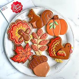 Colorful Autumn-Themed Cookies: Festive Shapes and Intricate Designs for Seasonal Gatherings.