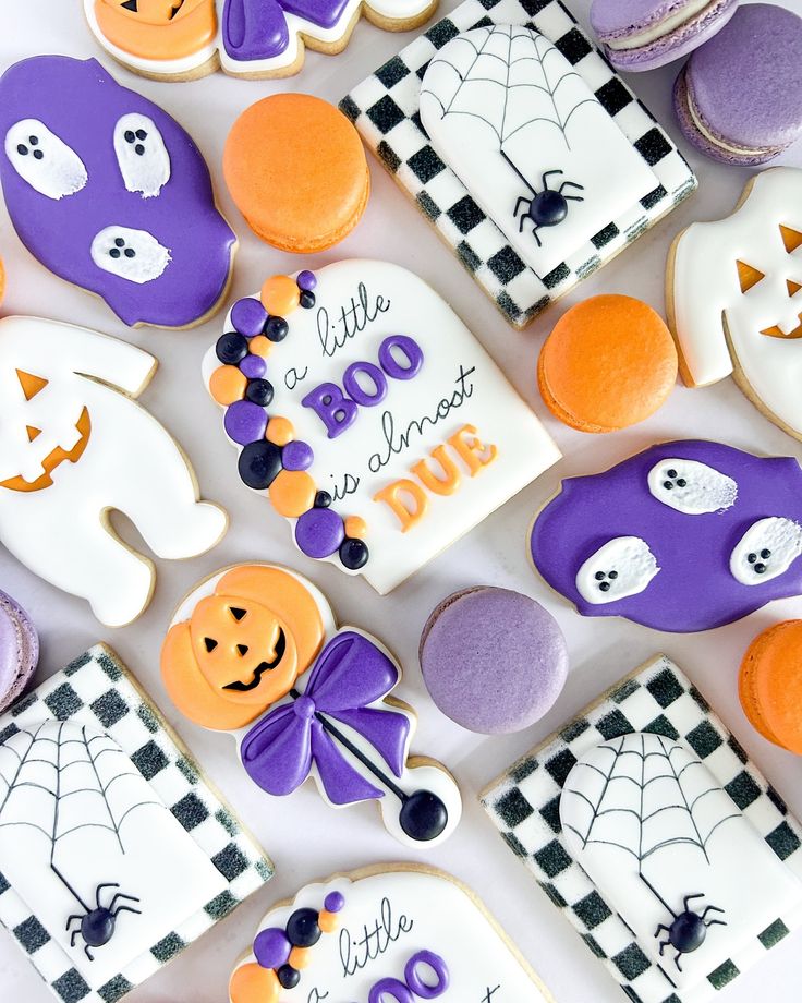 Whimsical Halloween Cookies Decorated with Colorful Ghosts, Pumpkins, and Spider Webs