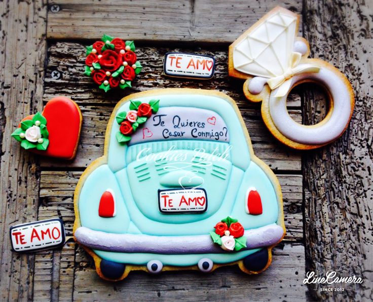 Whimsical Romantic Cookie Designs: Vintage Cars, Diamond Rings, and Floral Decor in Pastel Hues.