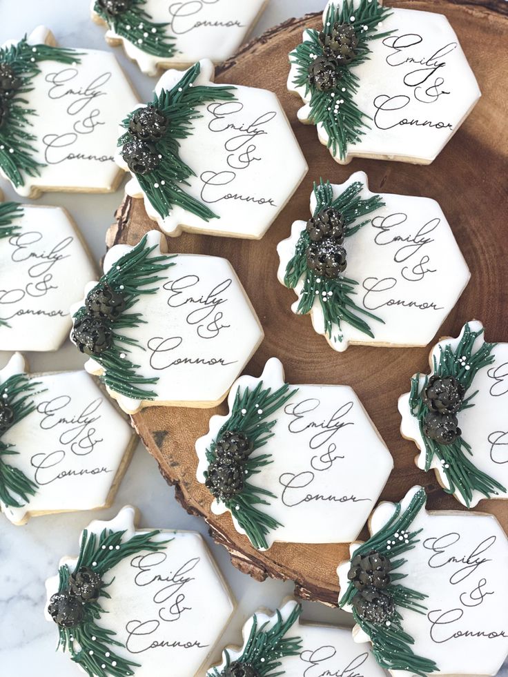 Elegant hexagonal decorative cookies with intricate greenery and floral designs for charming celebrations.