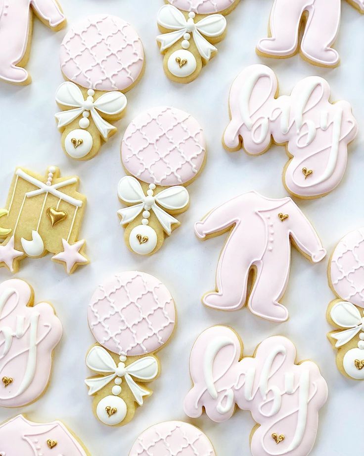 Charming Baby-Themed Cookies with Soft Pink Hues and Whimsical Decorations.