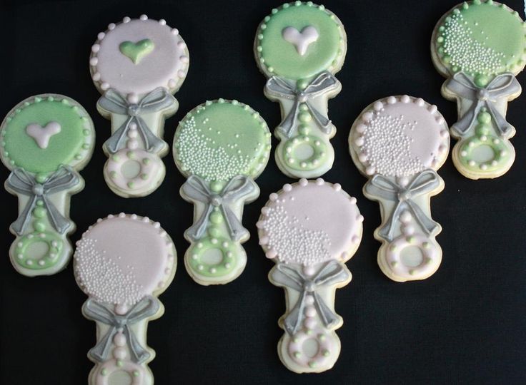 Charming Pastel Decorative Cookies with Intricate Designs and Textures for Events.