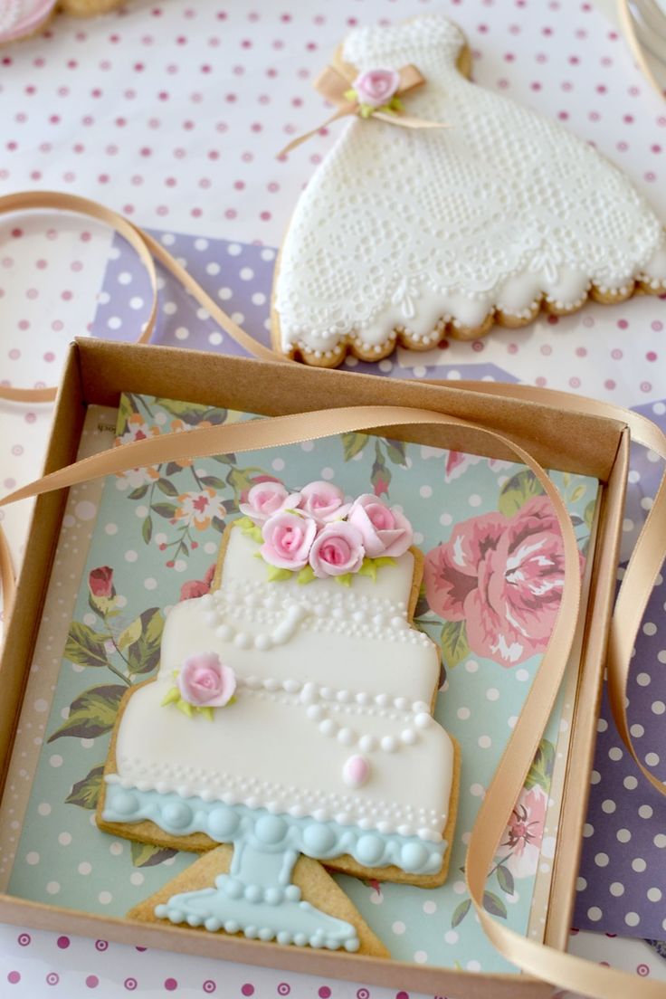 Delicate Wedding-Themed Cookies with Pastel Roses and Lace-Inspired Bridal Gown Design.