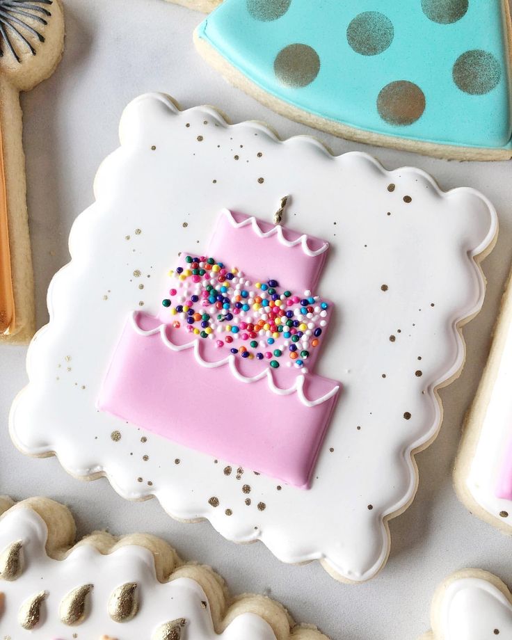 Festive Colorful Cookie Design with Pink Cake Motif and Delightful Icing Details.