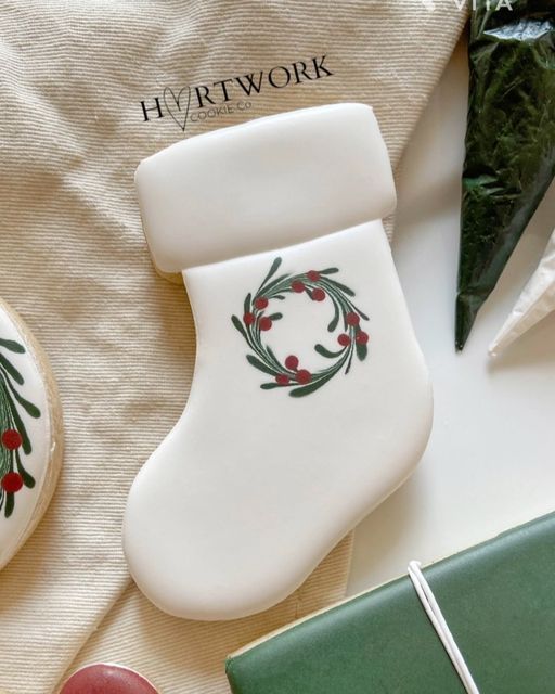 Charming Christmas Stocking Cookie Design with Elegant Icing and Festive Accents.