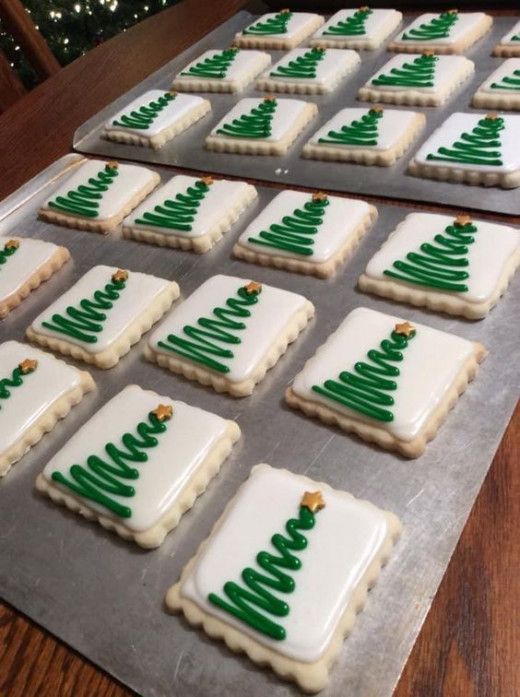 Cheerfully Decorated Holiday Cookies with Intricate Christmas Tree Designs.