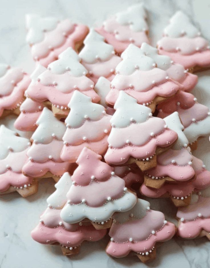 Charming Festive Tree-Shaped Cookies with Pink and White Icing for Holiday Celebrations.