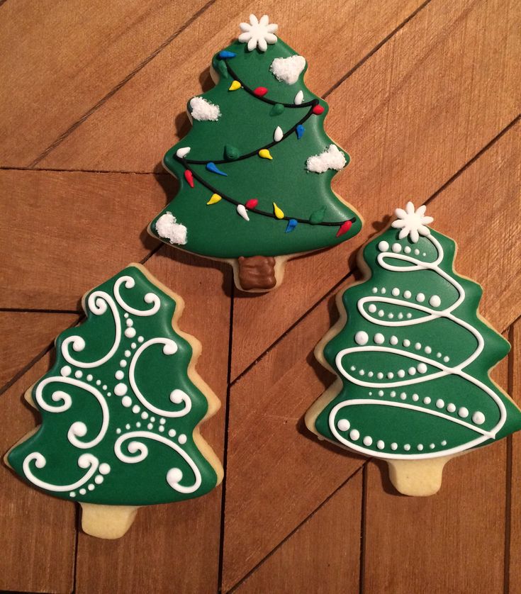 Vibrant Holiday Tree-Shaped Cookies with Unique Icing Designs.