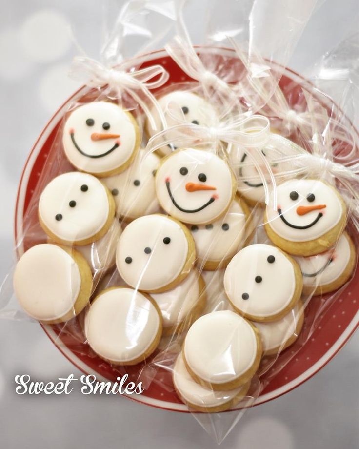 Festive Colorful Snowman Cookies in a Decorated Bowl for Holiday Cheer