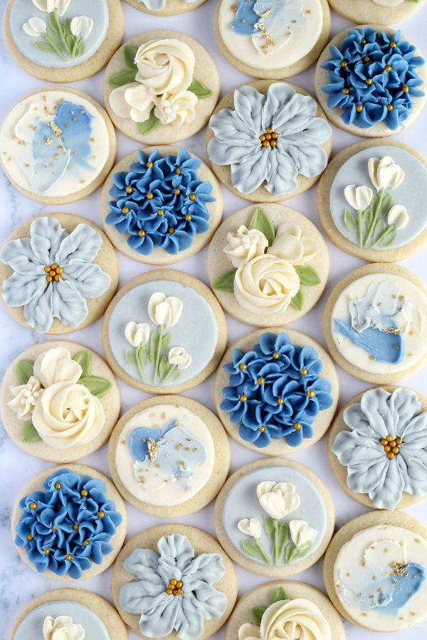 Elegant Floral-Themed Sugar Cookies in a Striking Blue and White Circular Arrangement