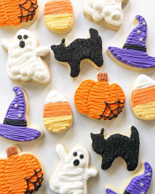 Vibrantly Iced Halloween Cookies Create Festive Atmosphere with Playful Designs.