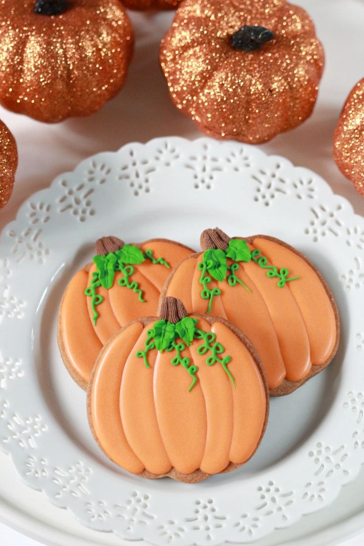 Festive Pumpkin Cookies with Vibrant Icing and Whimsical Designs Perfect for Autumn Celebrations