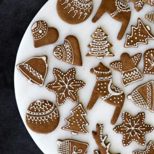 Festive Assorted Gingerbread Cookies with Intricate Icing Decorations.