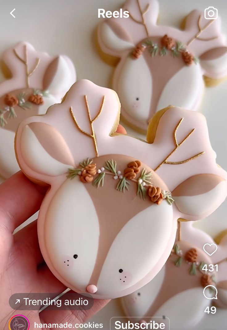 Whimsical Reindeer-Shaped Cookies: Pastel Decor and Floral Accents for Festive Treats.