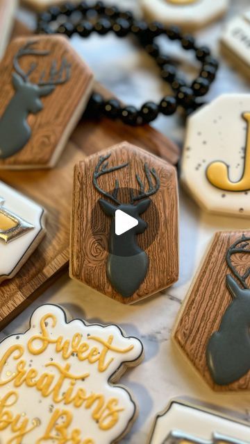 Intricate Decorative Cookies with Rustic Wooden Texture and Deer Silhouette for Festive Occasions.