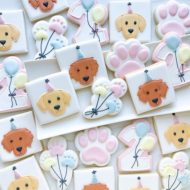 Whimsical Dog-Faced Cookies with Colorful Balloons for Cheerful Celebrations.