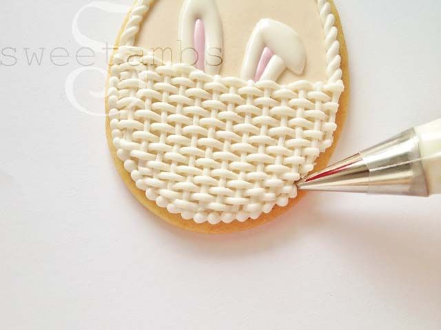 Charming Pastel Icing Design with Woven Basket Pattern and Playful Bunny Ears