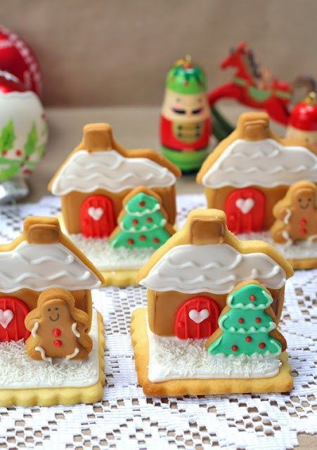 Charming Festive Cookies Styled as Colorful Gingerbread Houses for Joyful Holiday Celebrations.