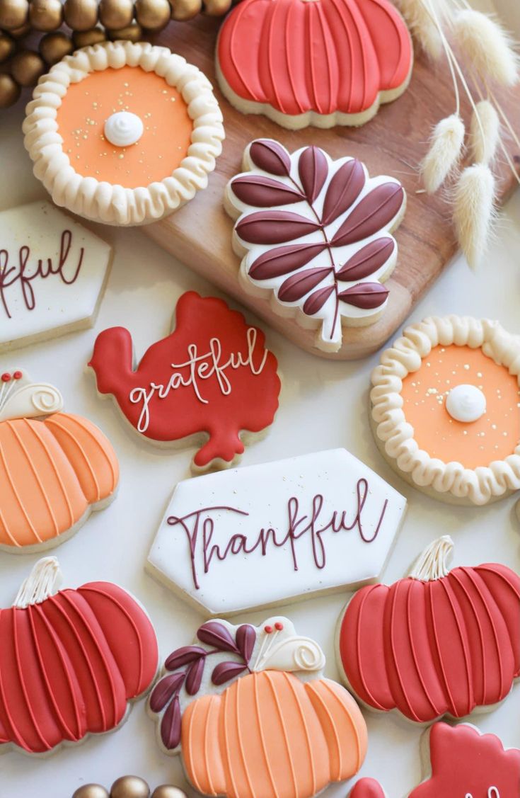 Elegant Autumn-Themed Cookies: Vibrant Pumpkin and Leaf Designs for Seasonal Celebrations.