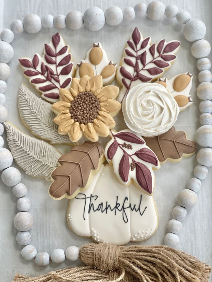 Autumn-Inspired Floral Cookie Art: Intricate Sunflower, Leaf, and Rose Designs in Warm Colors