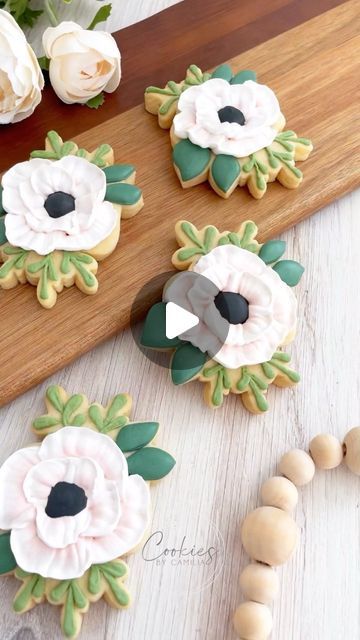 Intricate Floral Cookie Designs with Delicate Icing Techniques for a Spring-like Aesthetic.