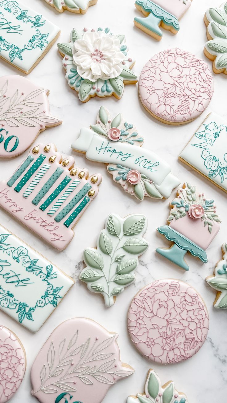 Elegant Pastel Cookie Designs with Floral Motifs for Special Occasions.