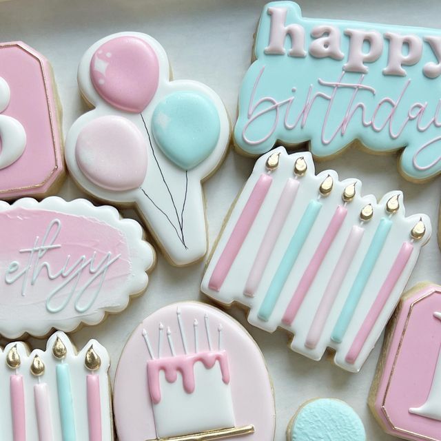 Festive Birthday Cookie Designs in Pastel Pink and Blue.