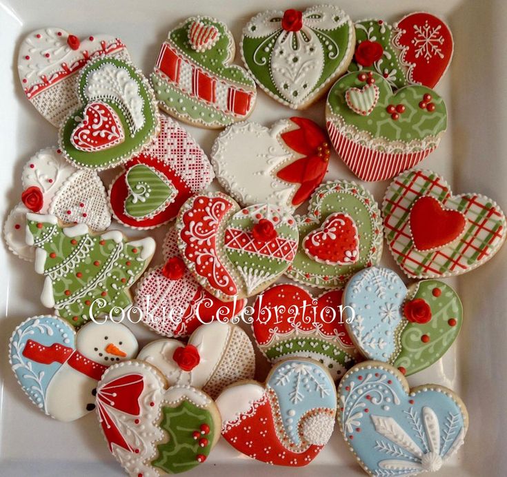 Festive Heart-Shaped Christmas Cookies with Intricate Designs and Vibrant Colors.