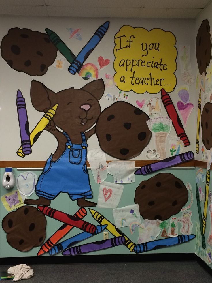 Vibrant Mural of Cartoon Animal with Crayons and Cookies Creates Inspiring Classroom Atmosphere.