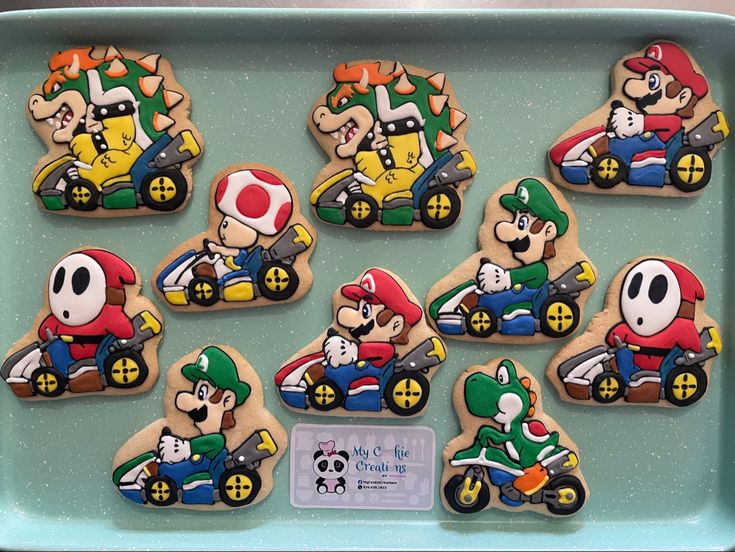 Vibrant Video Game Character Cookies: Intricate Designs of Mario, Luigi, and Bowser in Go-Karting Action.