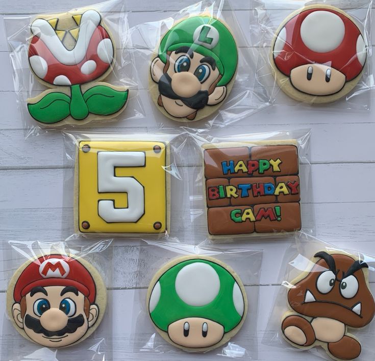 Video Game-Inspired Colorful Cookies with Nostalgic Designs and Intricate Icing.