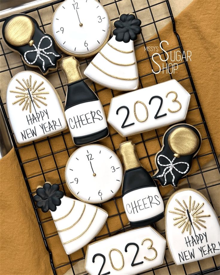 Elegant Gold and Black New Year's Cookies Featuring Festive Designs.