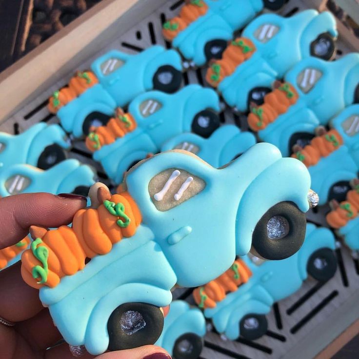 Whimsical Autumn Cookie Design: Vintage Blue Truck with Vibrant Pumpkin Display.