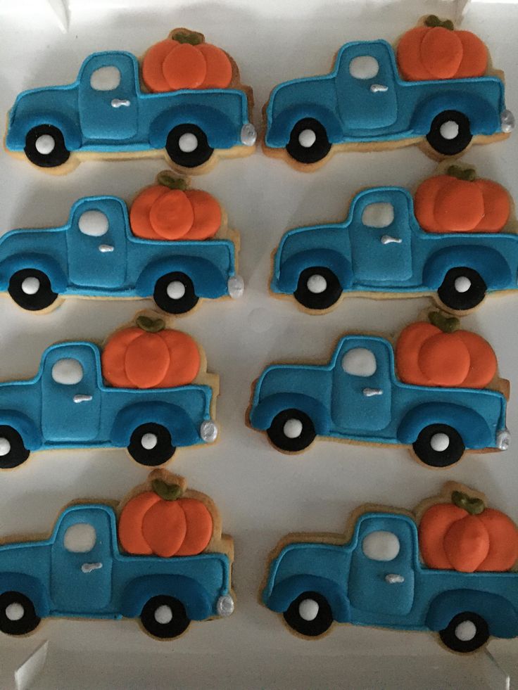 Festive Truck-Shaped Cookies: Blue with Orange Pumpkins for Autumn Gatherings.