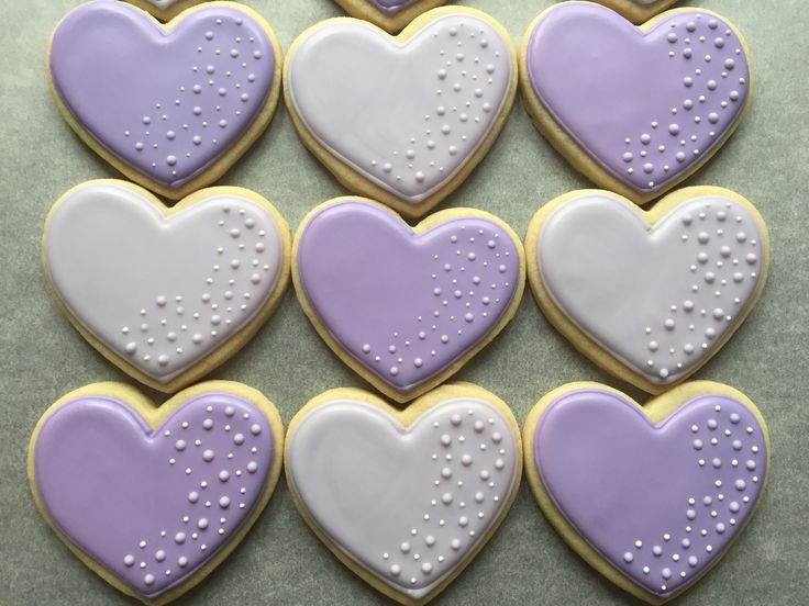 Elegant Heart-Shaped Cookies with Purple and White Icing Design