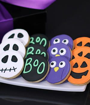 Festively Decorated Halloween Cookies Featuring Iconic Symbols