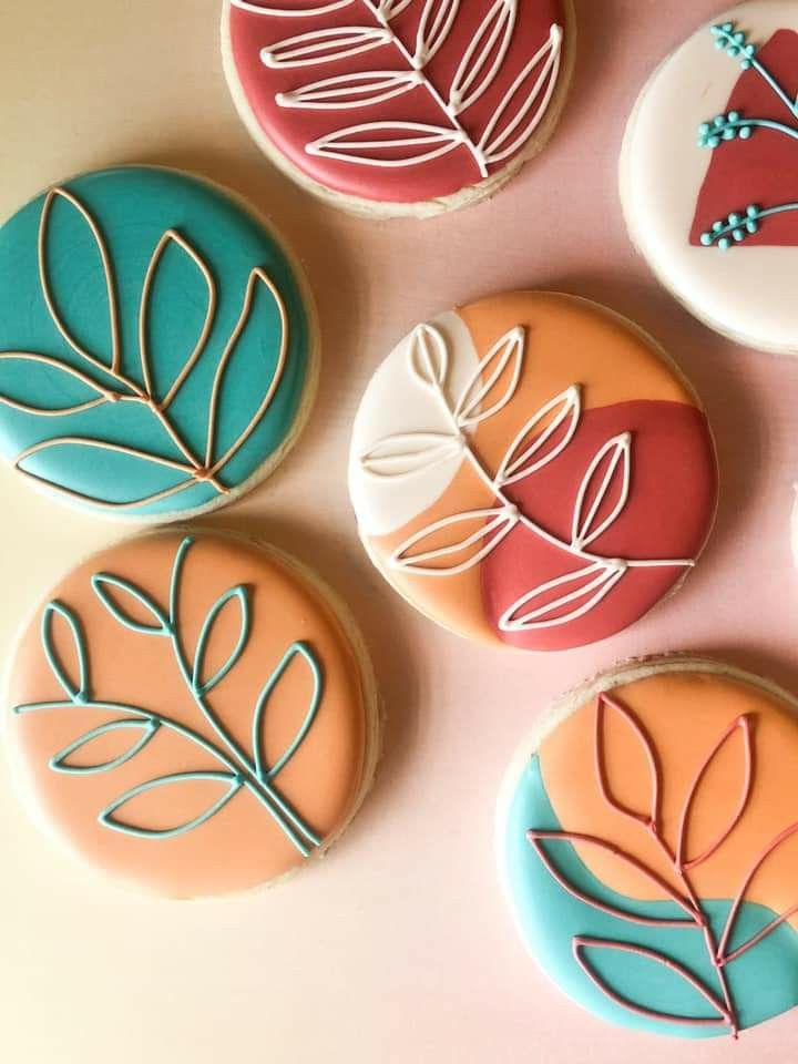 Elegant Leaf-Patterned Cookies in Soft Pastels Inspiring Organic Nail Art Design.