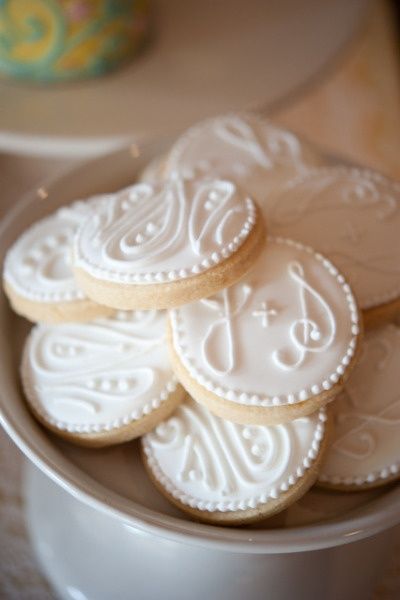 Elegant Decorative Cookies with Intricate Icing Designs for Special Occasions.