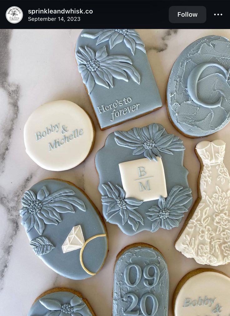 Charming Elegant Cookie Designs in Soft Blue: A Celebration of Love and Sophisticated Nail Inspiration.