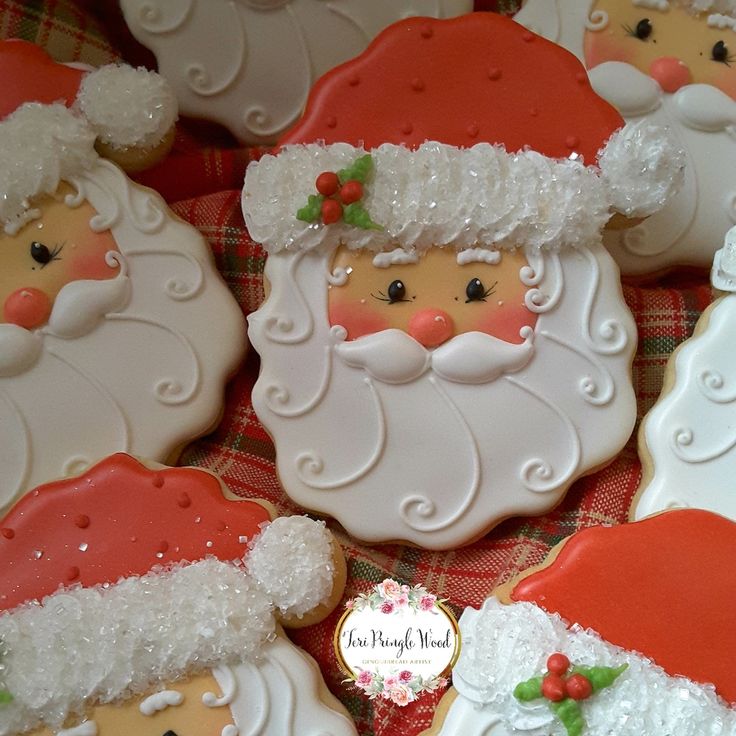 Delightful Santa-themed cookies with intricate frosting for festive holiday celebrations.