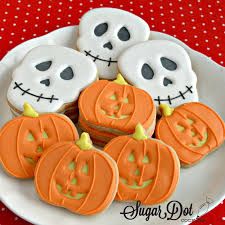 Festive Halloween Cookie Assortment: Whimsical Skull and Pumpkin Treats.