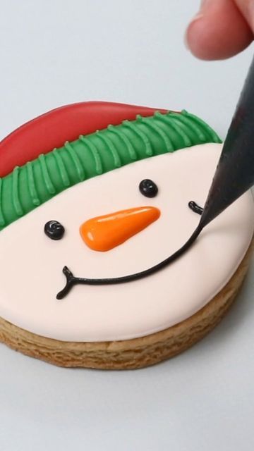 Snowman-Themed Festive Cookie Decorated with Colorful Icing for Holiday Cheer.